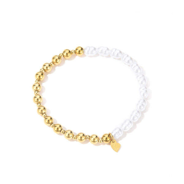 Armband met gouden bolletjes en imitatie parels